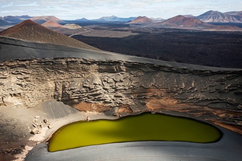 Aerial view of Playa de los Clicos in Lanzarote showcasing the unique volcanic terrain and a