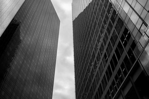 Black and white abstract view of high rise glass fronted office buildings in a Paris commercial and