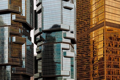 A vivid display of contrasting architectural styles in Hong Kong, showcasing modern skyscrapers