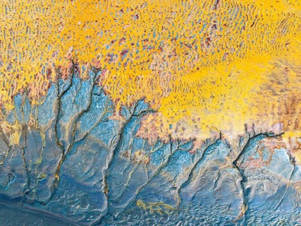 This image showcases an intricate arrangement of abstract fractals in vivid yellow and blue tones.