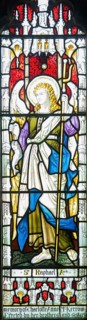 Stained glass window of Saint Raphael archangel, Ansford church, Somerset, England, UK