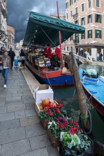 Selling fruit and vegetables from a boat, Venice, Veneto, Italy