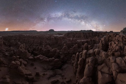 Captivating night view of Goblin Valley State Park, Utah, showcasing the majestic Milky Way arching