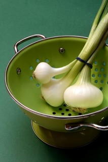 Onion, spring onions in sieve pot