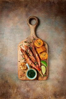Langoustines on skewers, shrimp kebab, with fried corn, spices and herbs, homemade, no people