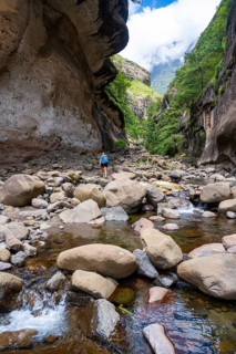 Female hiker in the Tugela Gorge or Tugela Gorge in the riverbed, Drakensberg National Park,