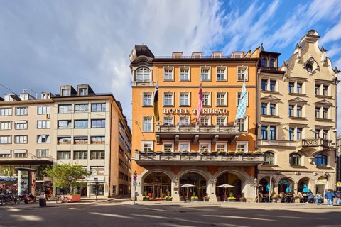 Hotel Torbräu, historic commercial building, German Renaissance style, balcony, dormers, façade