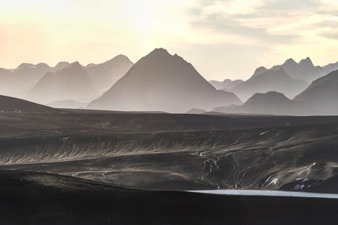 Captured at sunrise, this image showcases the breathtaking beauty of Iceland's highlands, featuring