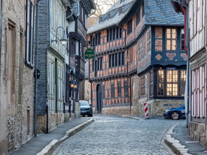 Alley with half-timbered houses and cobblestones in the historic old town, behind the Siemens