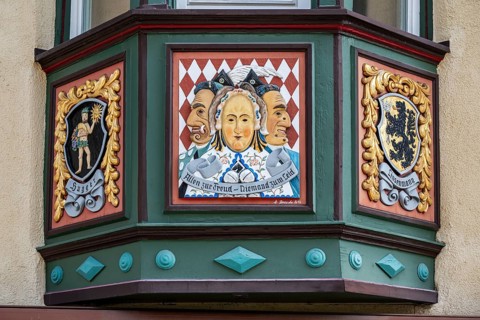 Artfully decorated bay window on a town house in the old town of Rottweil, it shows motifs from the