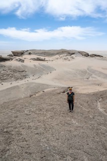 Tourist at Vogelfederberg, granite rocks, Namib Naukluft Park, Namibia