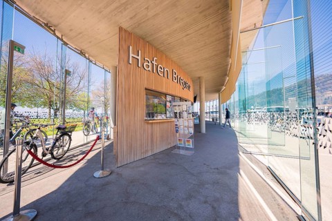Modern harbour with glass paneling and bicycles in sunny weather, Bregenz, Vorarlberg, Austria