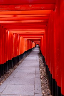 Discover the vibrant red torii gates of Fushimi Inari-taisha in Kyoto, Japan, a spiritual site