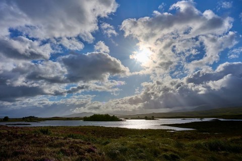 Peaceful landscape with a sunlit lake under clouds, Rannoch Moor, Bridge of Orchy, Scotland, United
