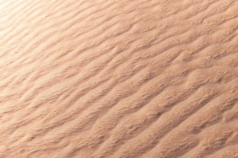 Close-up of La Puna desert capturing the intricate rippling sand textures formed by natural