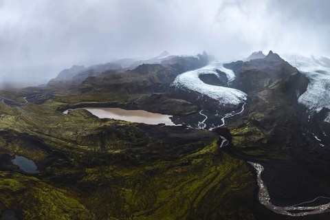 Atmospheric view of Vatnajökull Glacier, winding through the rugged landscape of Vatnajökull