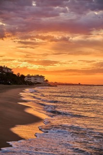 Sunrise with morning colors on a sandy beach near Tarragona, Catalonia, Spain