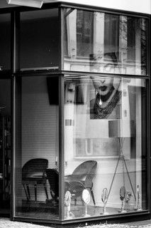 Black and white photograph, view through the window of a cosmetics shop, Berin, Germany