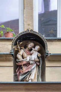 Healing figure on a residential and commercial building, Bamberg, Upper Franconia, Bavaria, Germany