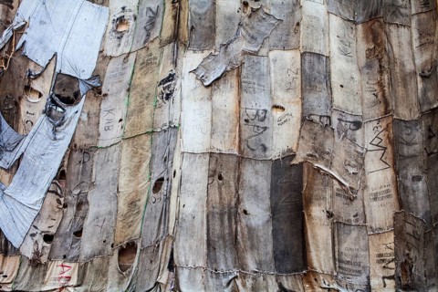 Torwache wrapped with old jute sacks, Check Point Sekondi Loco, by artist Ibrahim Mahama, documenta
