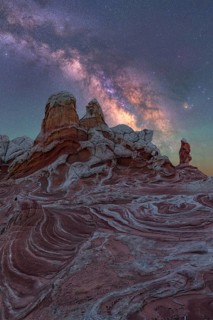 A stunning nightscape of the Milky Way illuminating the unique rock formations of White Pocket,