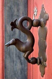 Braunschweig horse door knocker in the city centre on the front door of a half-timbered house,