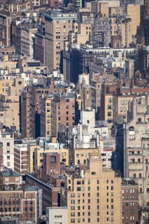 Dense cluster of New York City buildings, illustrating the architectural complexity and tightly