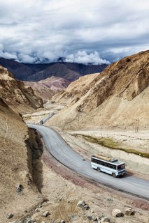 Indian passenger bus on NH-1 (Srinagar Leh national highway) in Himalayas. Ladakh, India
