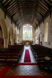 View of nave to west window, church of Saint Mary and Saint Peter, Kelsale, Suffolk, England, UK