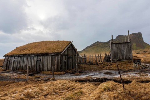Wickinger buildings against mountain backdrop, winter, Stokksnes, Vestrahorn, Klifatindur, Höfn,