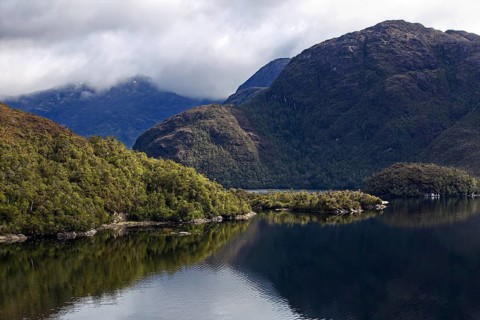 Mountain landscape with elevations of different heights, taken from the deck of a cruise ship. The