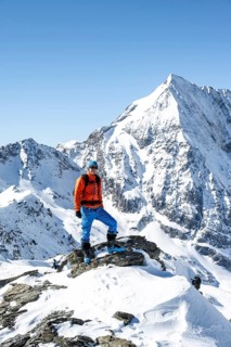 Ski tourers on foot, mountain panorama with snow-covered mountain landscape in winter, view of