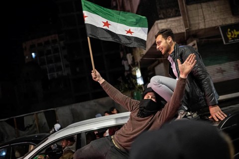 Damascus, Syria. December 7th 2025. Syrians waving flags and celebrating one year since the fall of