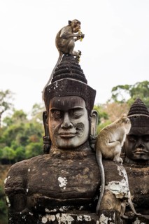 Figures and monkeys on the bridge to Angkor Thom, macaques, sunset, Angkor Wat, Angkor, UNESCO