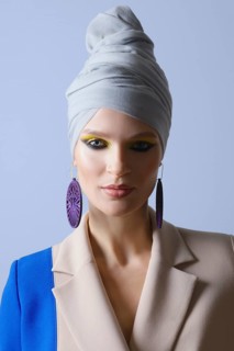 Beautiful lady in double color suit and turban on head