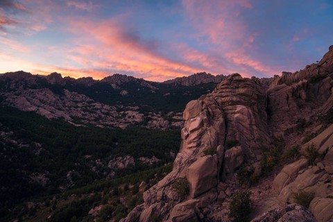 Stunning sunset over the rugged rock formations of Pedriza in the Sierra de Guadarrama, near Madrid