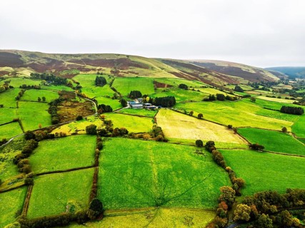 Autumn colours of Farms over River Wye and Road A470 from a drone, Llanidloes, Powys,