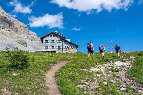 Hikers in front of Rifugio Graffer, Brenta, Brenta-Adamello Natural Park, Trentino, Italy