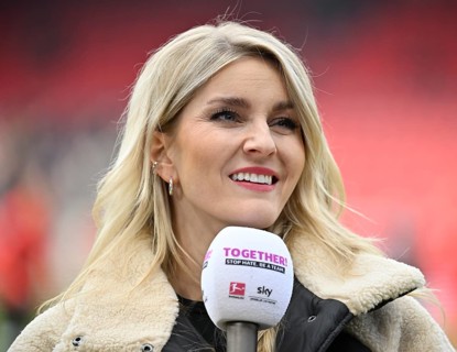 Interview microphone logo in the hand of SKY presenter reporter Lisa Hofmann Portrait smiling