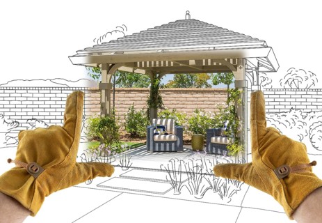 Male Contractor Hands Framing Completed Section of Custom Pergola Patio Cover Design Drawing