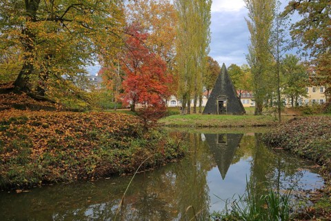 Pyramid as a monument to Prince Frederick at the pond with autumn colors and reflections, park,