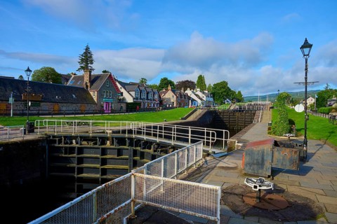 Colourful houses along a lock under clear sky, Caledonian Canal, Fort Augustus, Loch Ness,