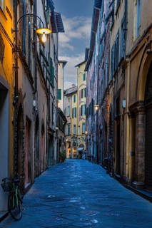 Narrow alley, historic city centre, at dawn, Lucca, Tuscany, Italy
