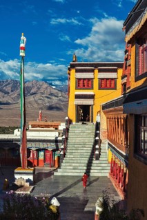 THIKSEY, INDIA, SEPTEMBER 13, 2012: Young Buddhist monk running in the courtyard of Thiksey gompa
