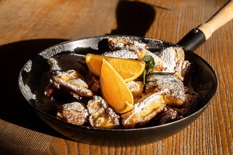 A scrumptious serving of Austrian Kaiserschmarrn, an iconic shredded pancake, topped with powdered