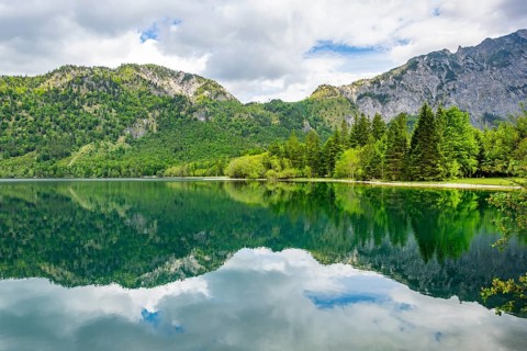 Landscape of Lake Offensee after rain when the sun comes through the clouds in spring,
