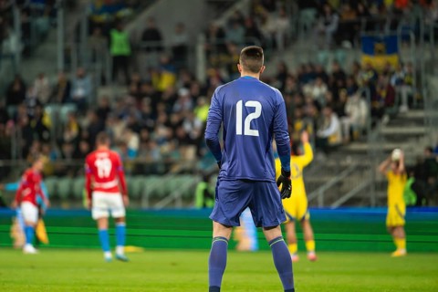Goalkeeper's back during soccer match