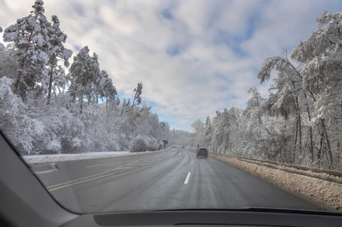View from car, snowy landscape with cleared federal road, Heroldsberg, Middle Franconia, Bavaria,