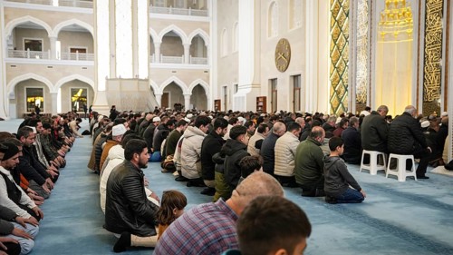 Muslims perform Tarawih prayers at the Millet Mosque, the second largest mosque in Turkey, which is