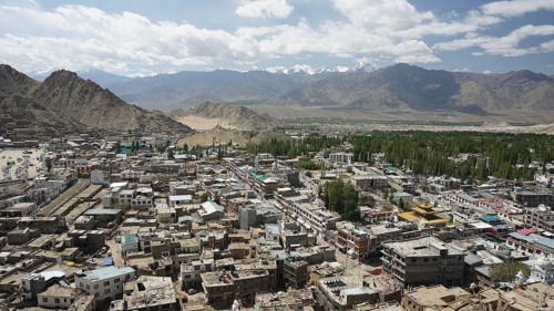 City view from Leh Palace over Leh with mountains and cloudy sky, Ladakh, North India, Himalayas,